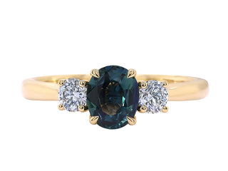 18KT YG TEAL SAPPHIRE AND DIAMOND RING.