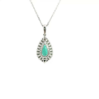 18KT WYG DIAMOND AND EMRALD PENDANT